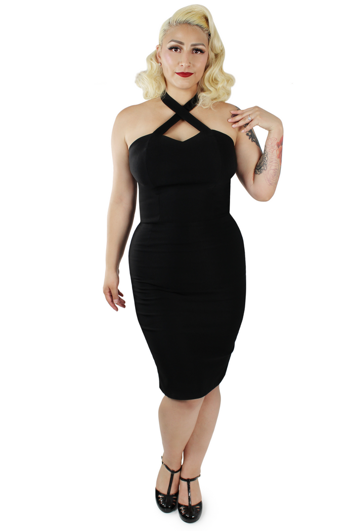 Model wearing dress, hand on shoulder