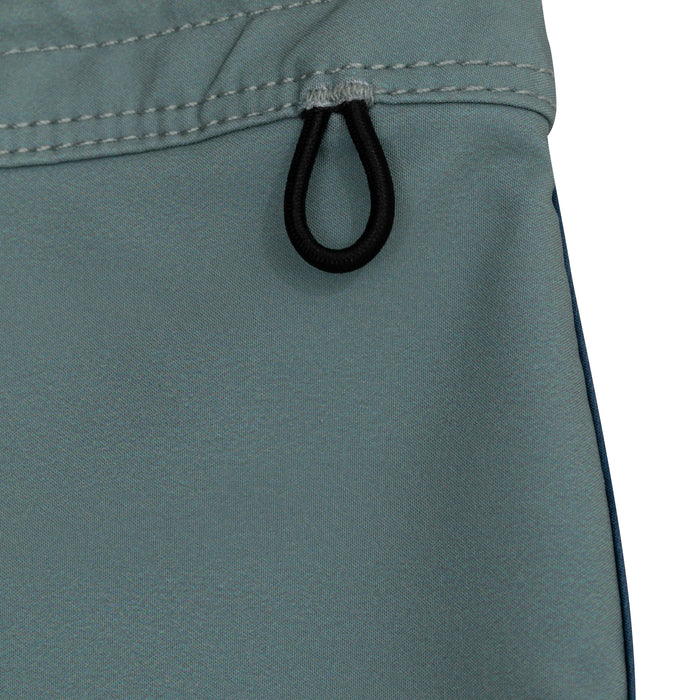 Close-up of the black elastic drawcord loop on the waistband of the Waihana Dawn Patrol W1 board shorts in teal green, highlighting stitching and construction detail.