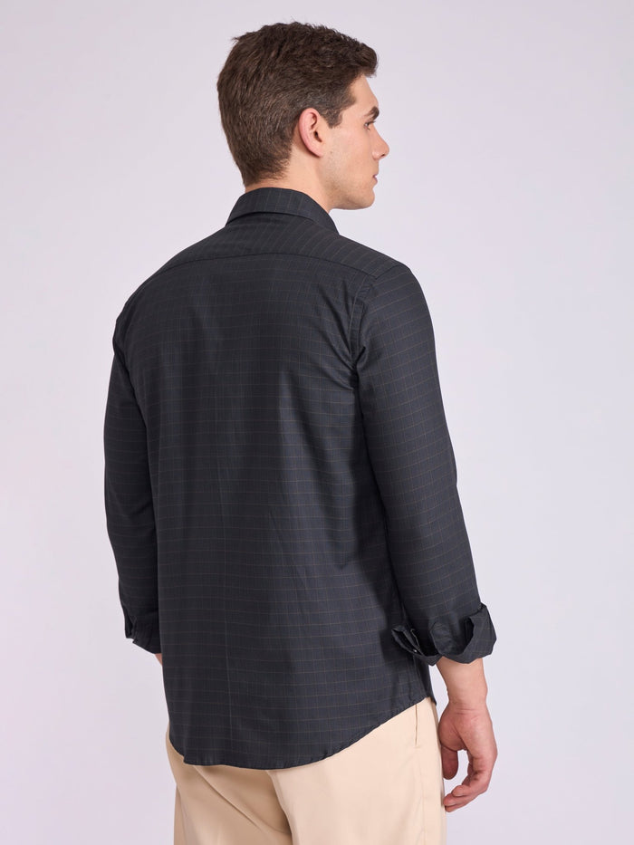 Man wearing a dark slate gray checkered shirt.