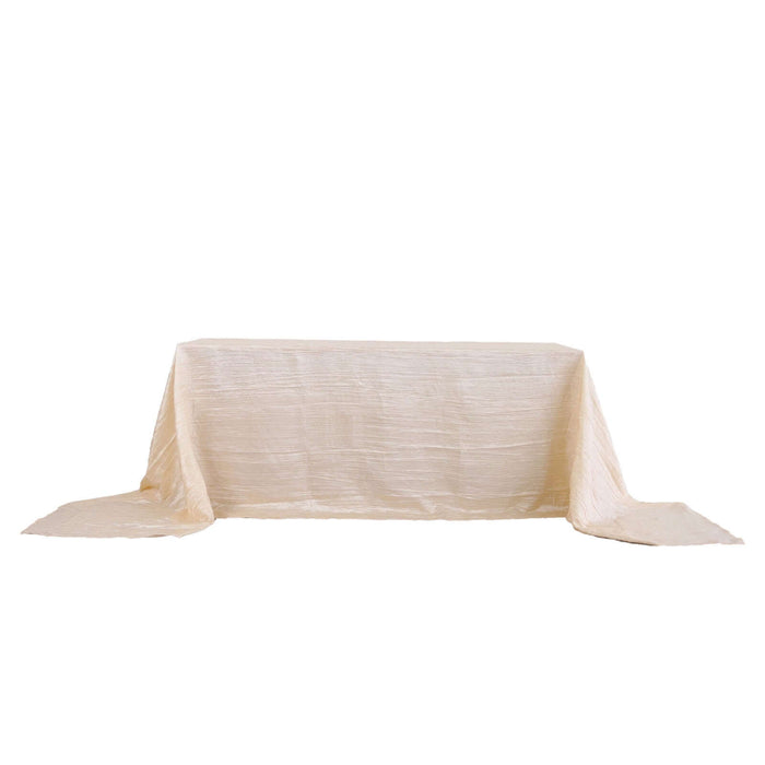 Cream textured tablecloth draping elegantly over a table