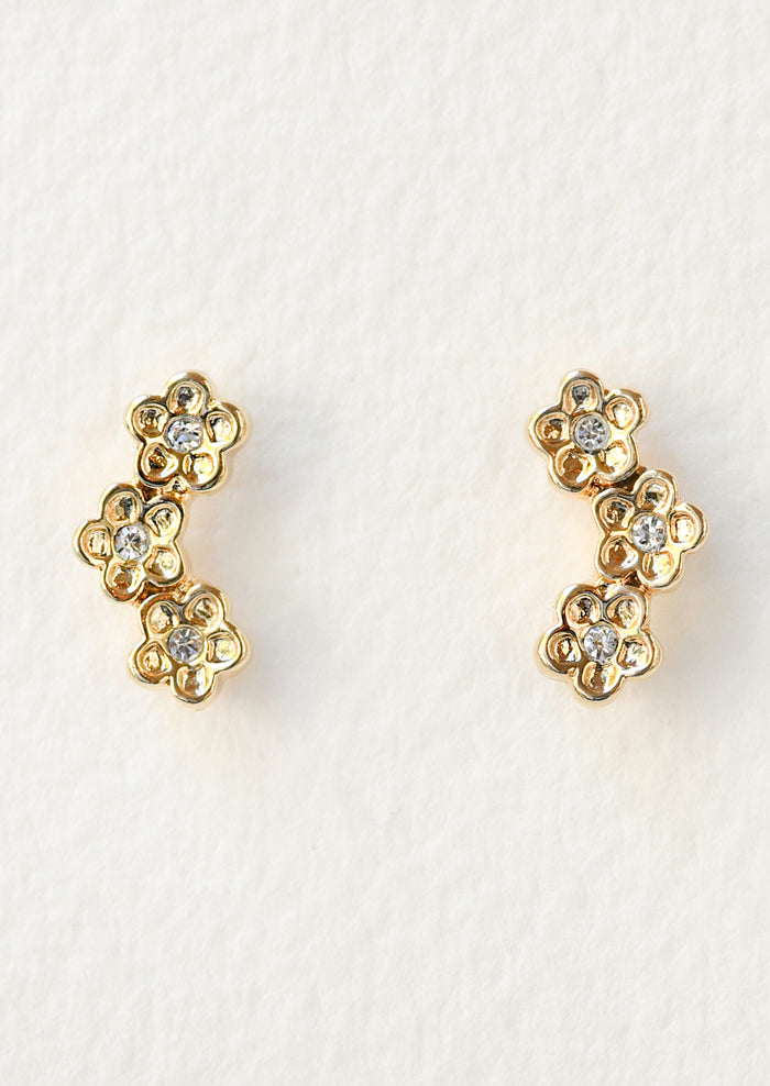 A pair of stud earrings each featuring a trio of flowers with crystals in the center.