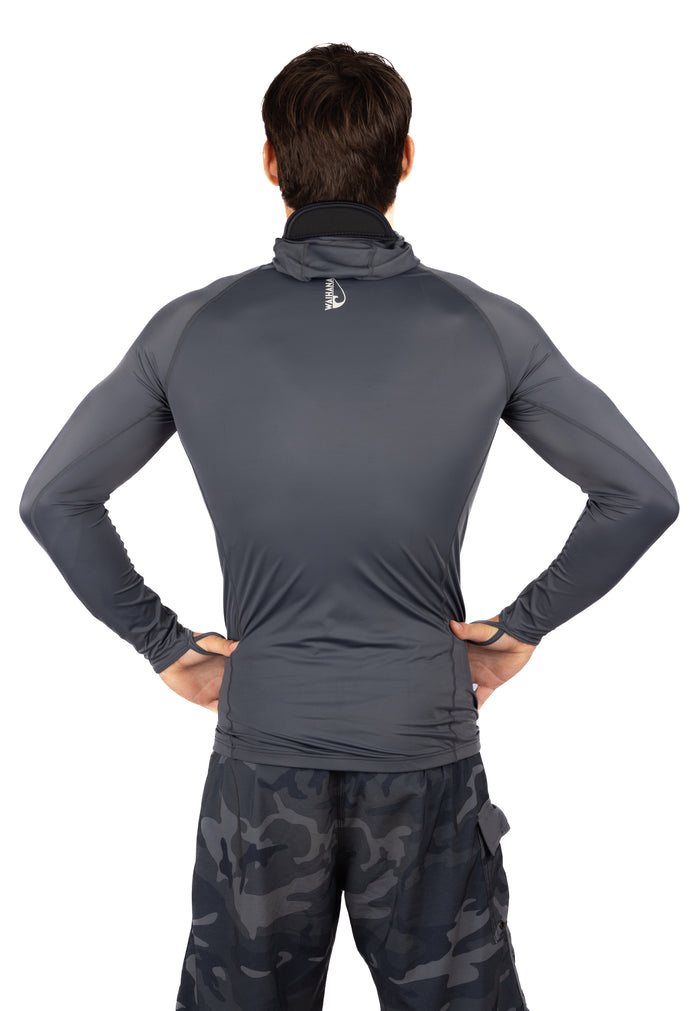 Back view of a man wearing the Waihana Anthracite Carvico Hooded Surf Rashguard in grey with a black neoprene collar, paired with dark camo shorts, on a white studio background.