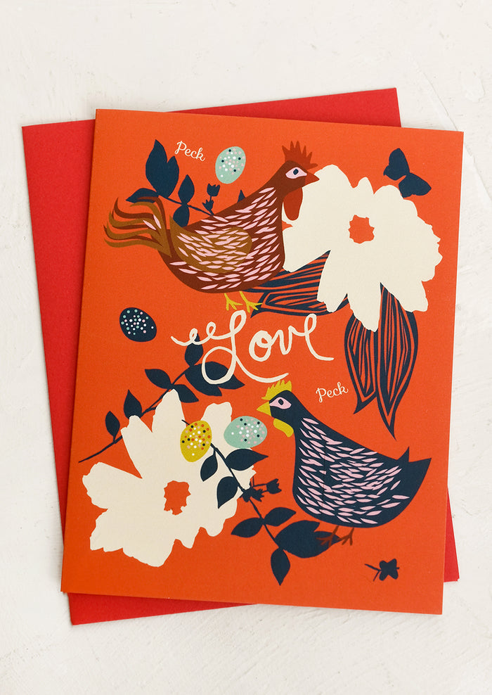 A card with illustrations of chickens and flowers, small text reads "Peck LOVE peck".