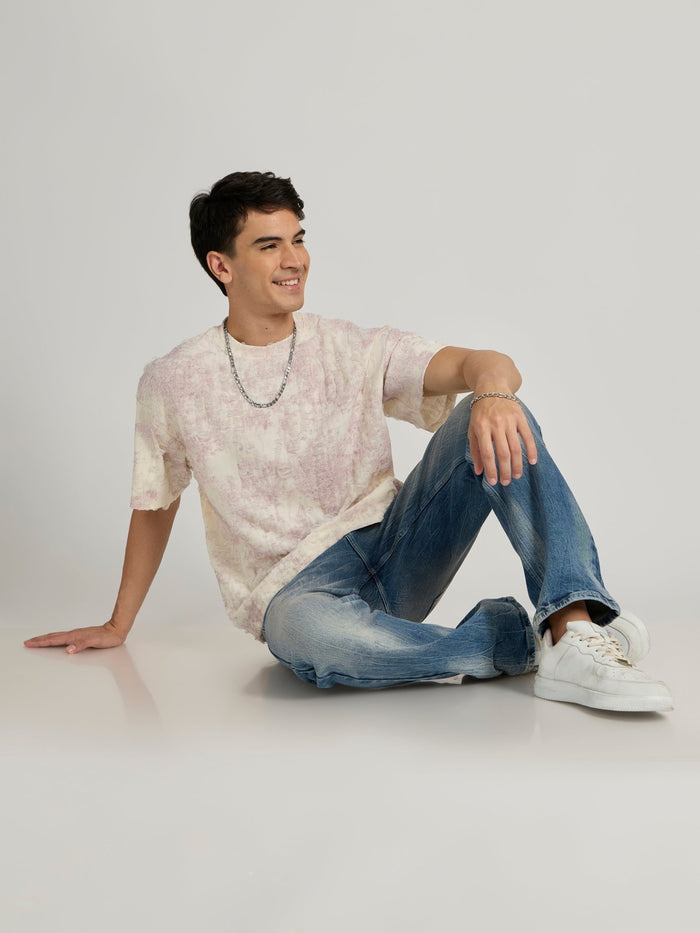 man wearing a Distressed Oversized T-Shirt - Pink