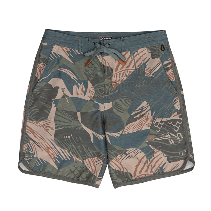 Waihana Hawaiian Brushstroke Cruiser Board Shorts laid flat on a white background, showing a tropical leaf and fish camo pattern in olive, slate blue, blush, and rust tones with a grey drawstring waistband.