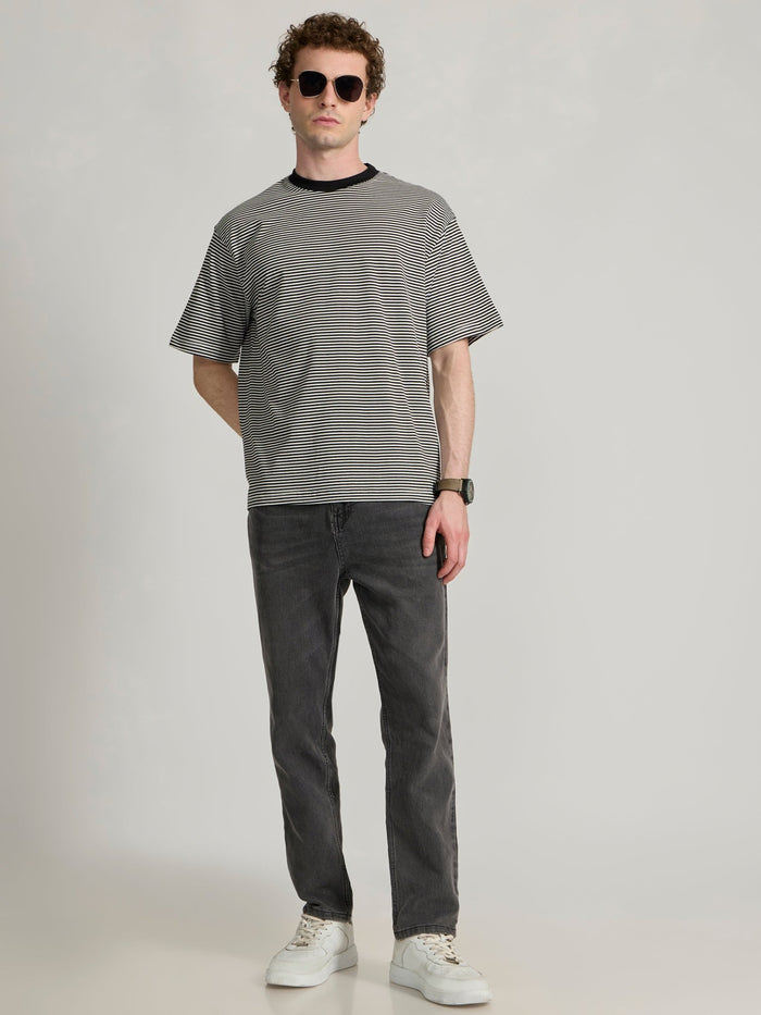 Man wearing a white and black striped crew t-shirt