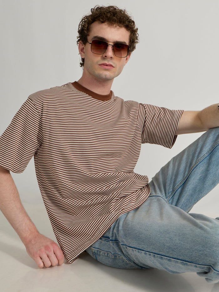 Man wearing a brown striped crew t-shirt