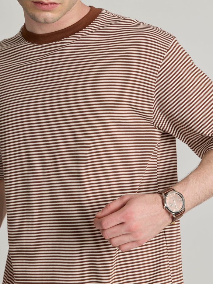 Man wearing a brown striped crew t-shirt