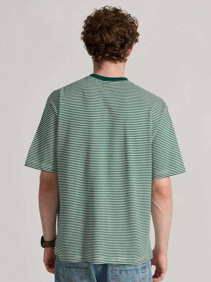 Man wearing a green  and white striped crew t-shirt