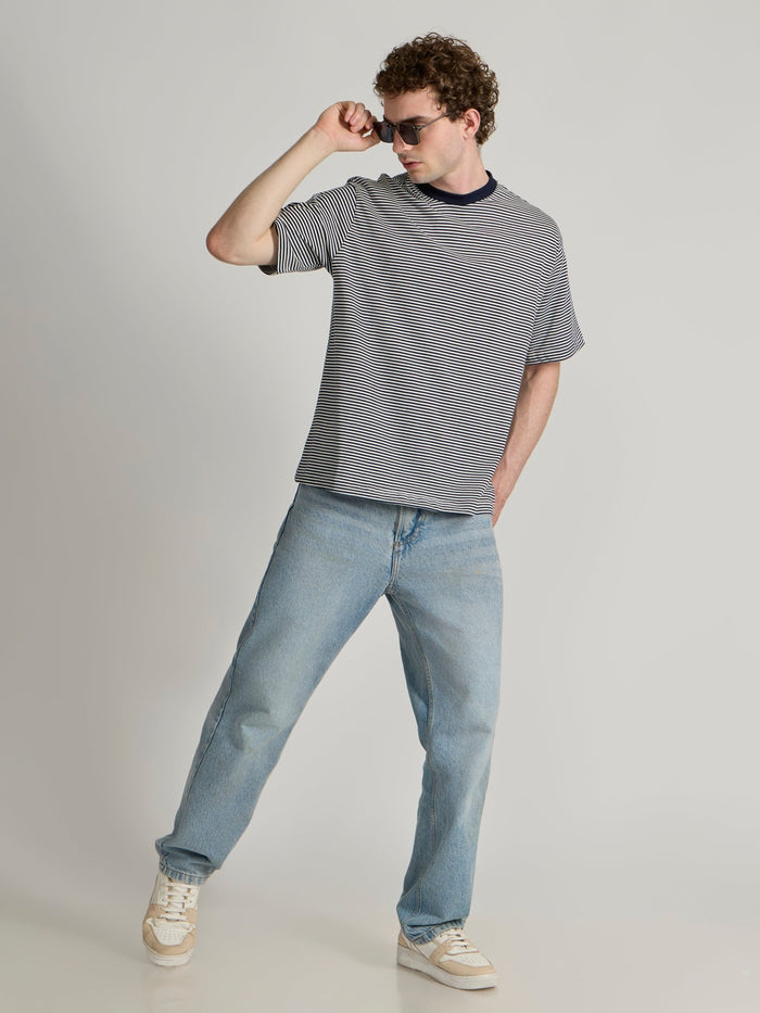 Man wearing a navy blue striped crew t-shirt