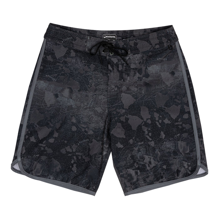 Waihana Island Aloha W1 board shorts laid flat on white background, featuring an all-over dark charcoal Hawaiian island map camo print with grey side stripe trim and black drawstring waist.