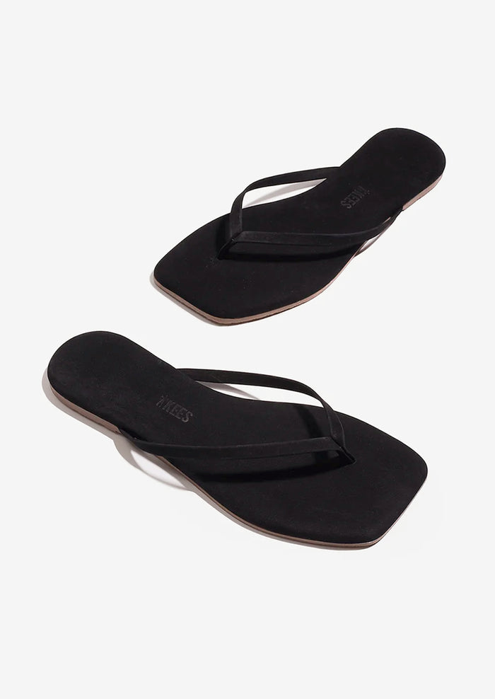 A pair of suede square toe TKEES sandals in black.