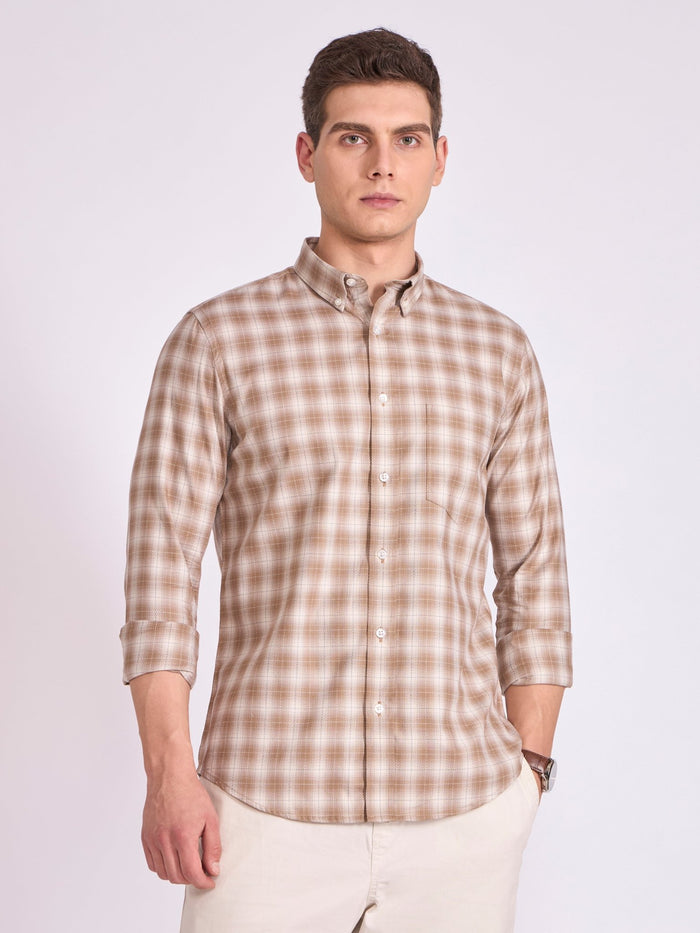 Man wearing a brown  checkered shirt .