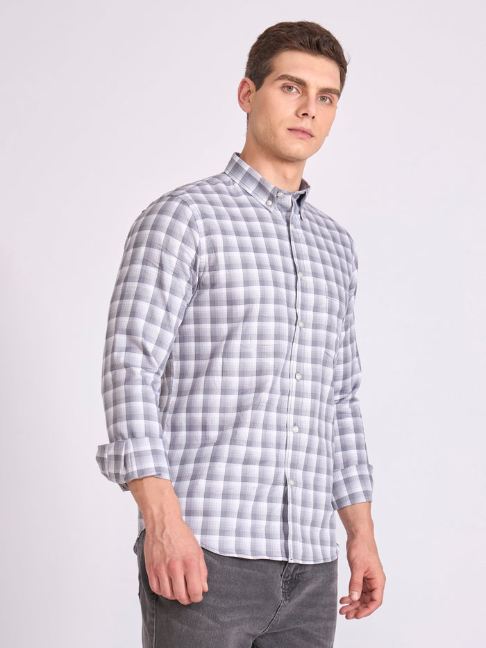 Man wearing a classic grey checkered shirt.