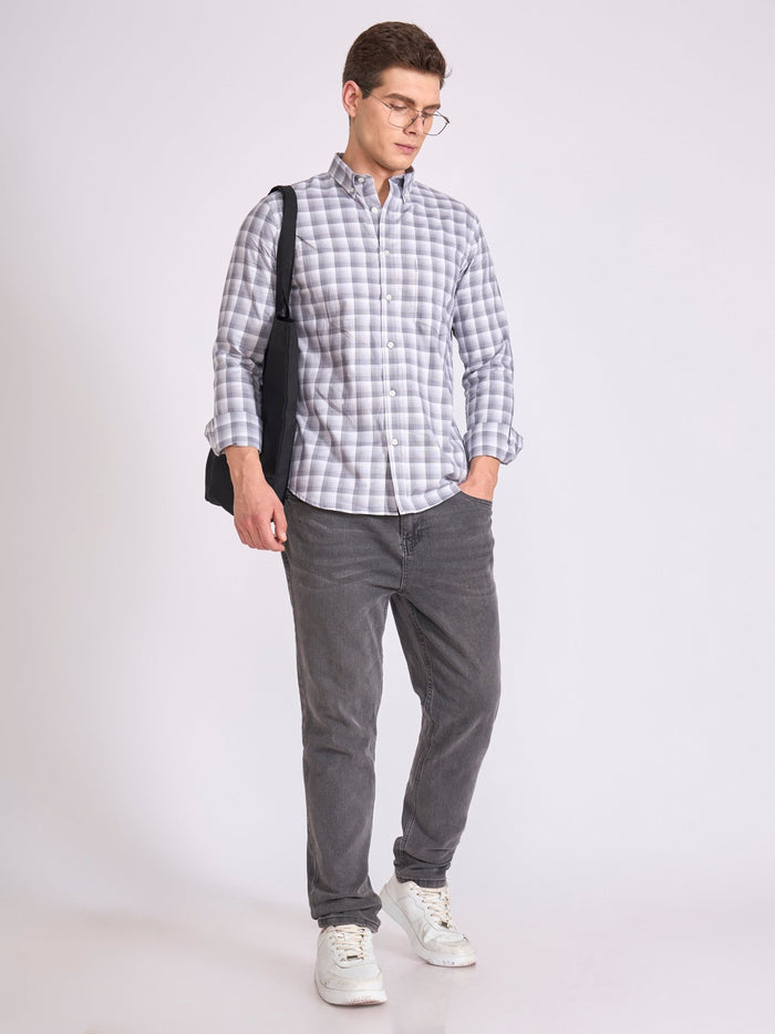Man wearing a classic gray checkered shirt.