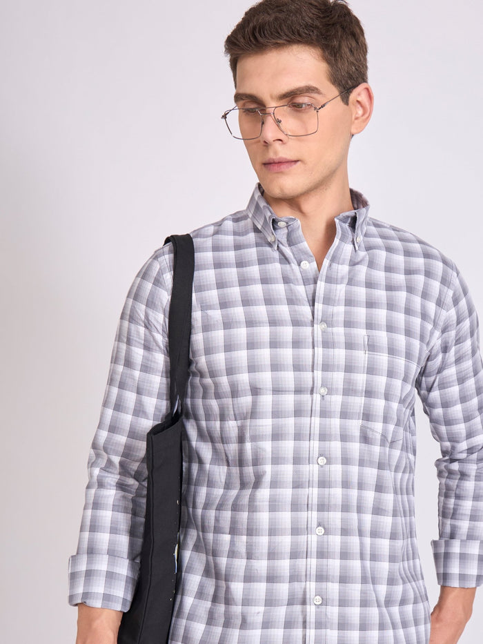Man wearing a classic gray checkered shirt.
