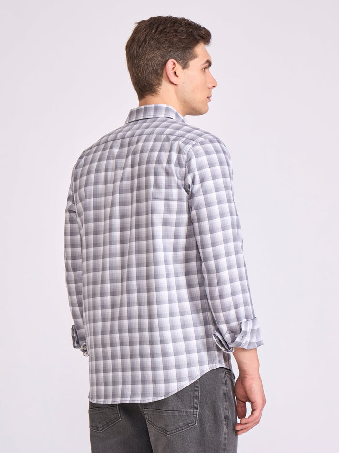 Man wearing a classic gray checkered shirt.