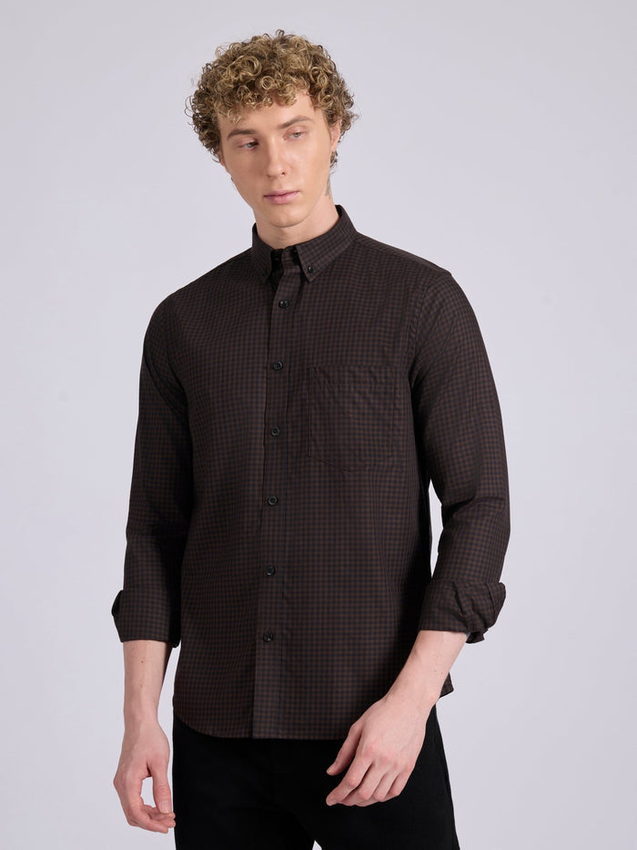 Man wearing a dark brown  micro checkered shirt .
