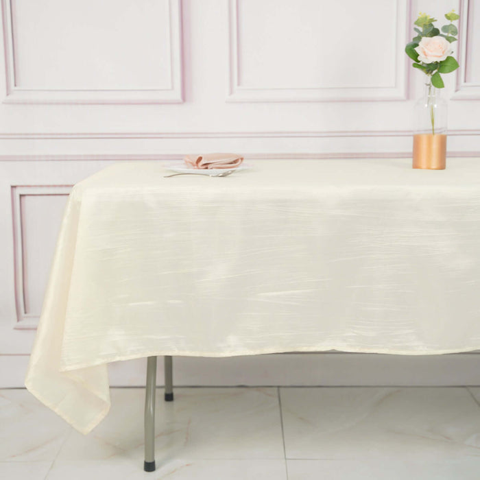 Elegant cream tablecloth on a dining table with minimalist decor.