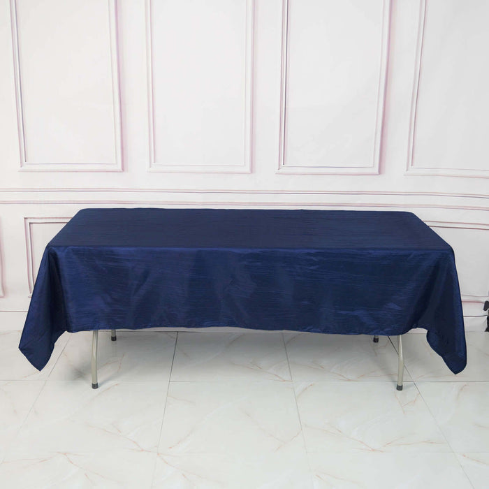 Navy tablecloth draped over a table in a studio setting