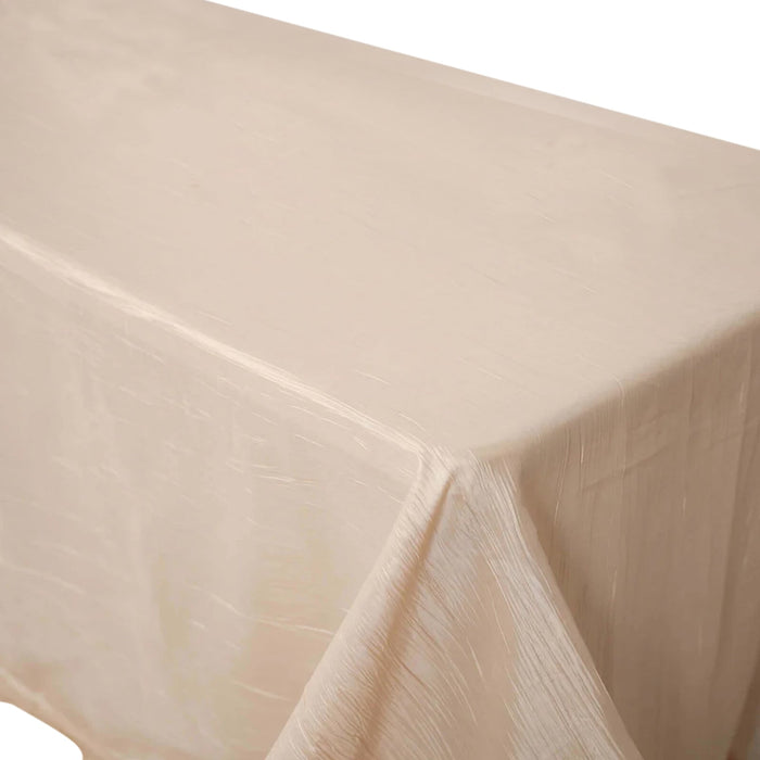 Cream-colored tablecloth draped elegantly over a table.