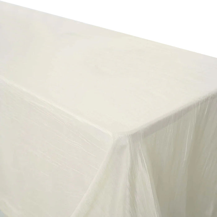 White tablecloth draped over a table on a plain background