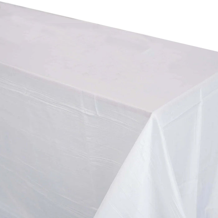 White tablecloth draped elegantly over a table edge