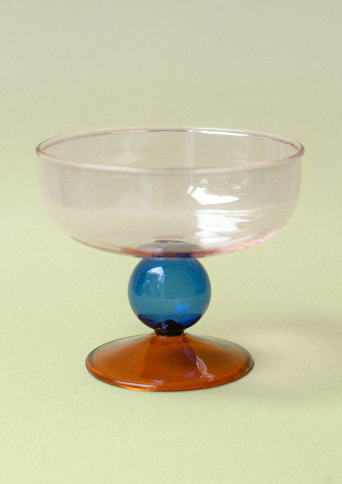 A colorful couple glasses with modern shape in pink, blue and brown.